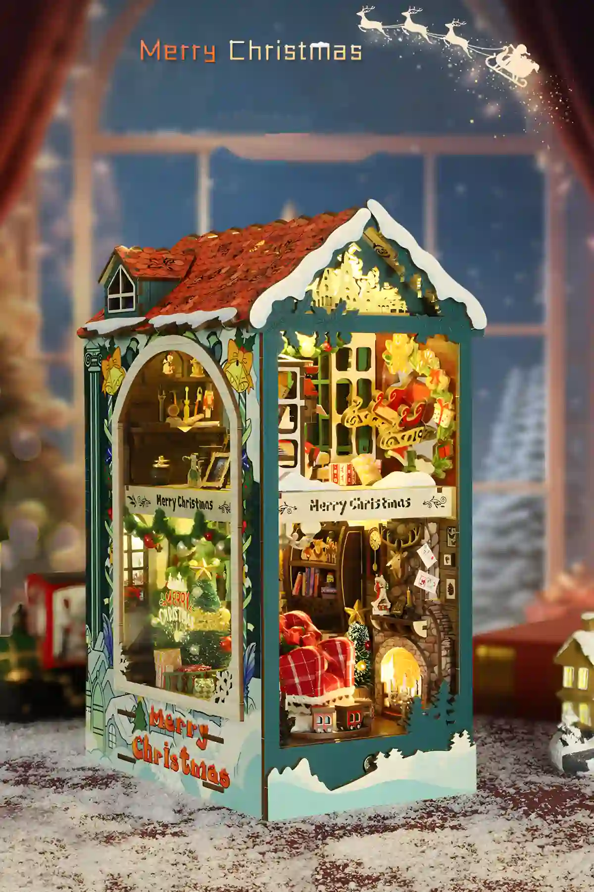 Complete illuminated Merry Christmas book nook display, two-story Winter Wonderland scene.
