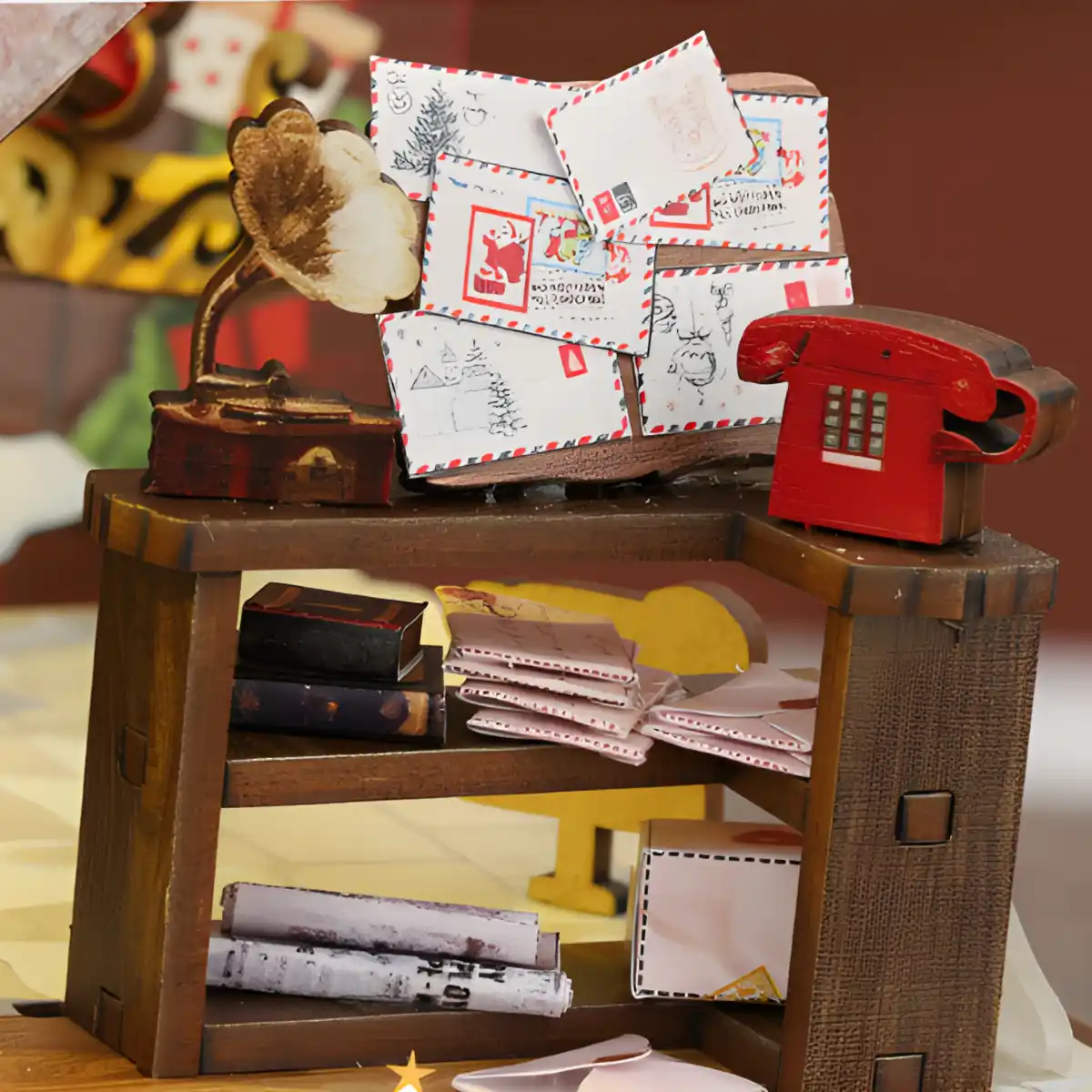 Santa's letter desk, tiny envelopes, red phone, and gramophone for DIY Book Nook.