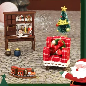 Miniature components: armchair, train, desk, and tree, ready for Festive miniature kit assembly.