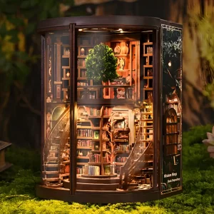 Two-story Wisdom Rings Bookstore book nook kit, spiral staircase, central tree, miniature library, enchanting lighting.