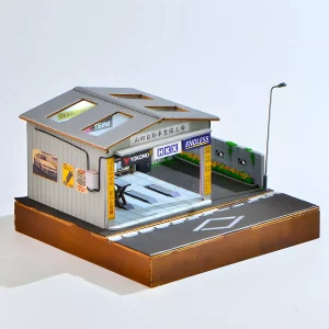 Side view of finished Yamada Auto Repair Garage Miniature House with JDM posters and street lamp.