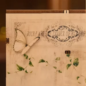 Decorative side panel with butterfly design and quote, Art Bookstore DIY Book Nook Kit vintage detail.