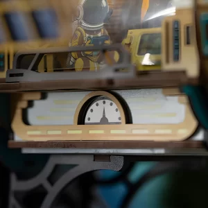 Close-up of internal Aerospace Components showing a pressure gauge and astronaut figure.