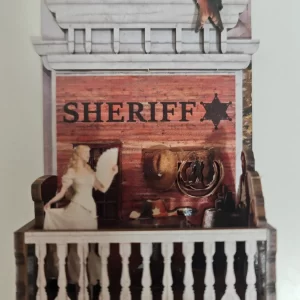 Miniature woman in white on a balcony, Wild West diorama kit character detail.
