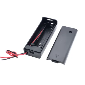 Internal view of 1.5V AA battery holder showing secure slot, metallic spring contact, and removable slide cover.