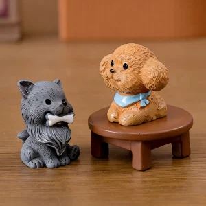 Grey resin dog miniatures with bone and brown poodle on mini table display
