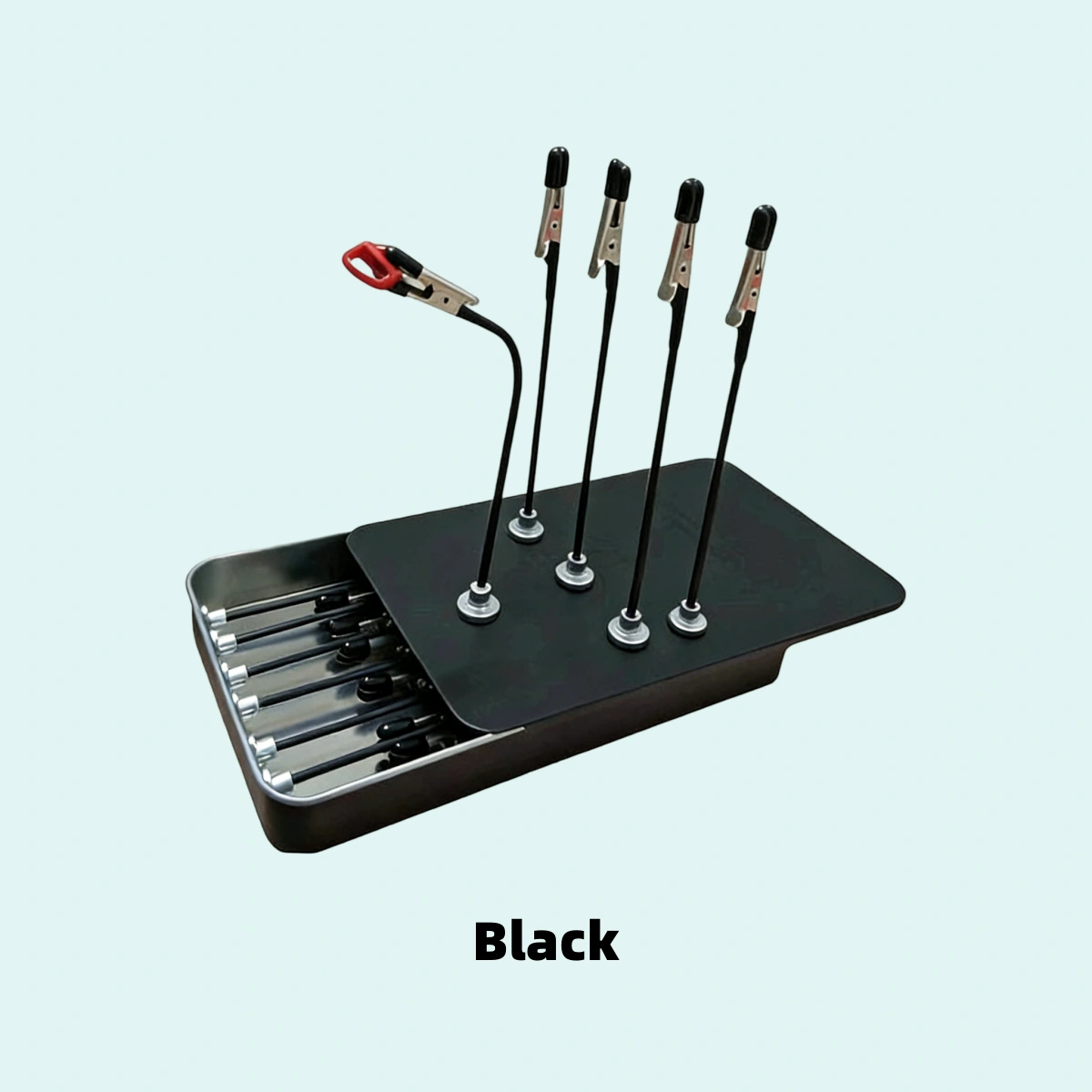 Black magnetic model holder with adjustable alligator clips and portable metal storage base.