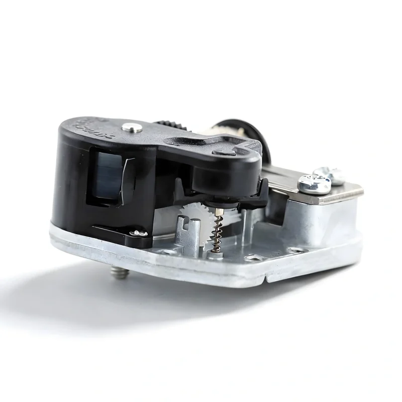 Side profile of a mechanical music box mechanism highlighting the governor fan and gear train.