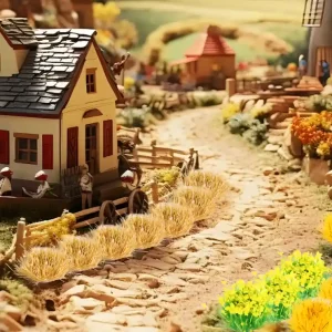 Yellow and dried grass model flower clusters lining a stone path in a miniature village.