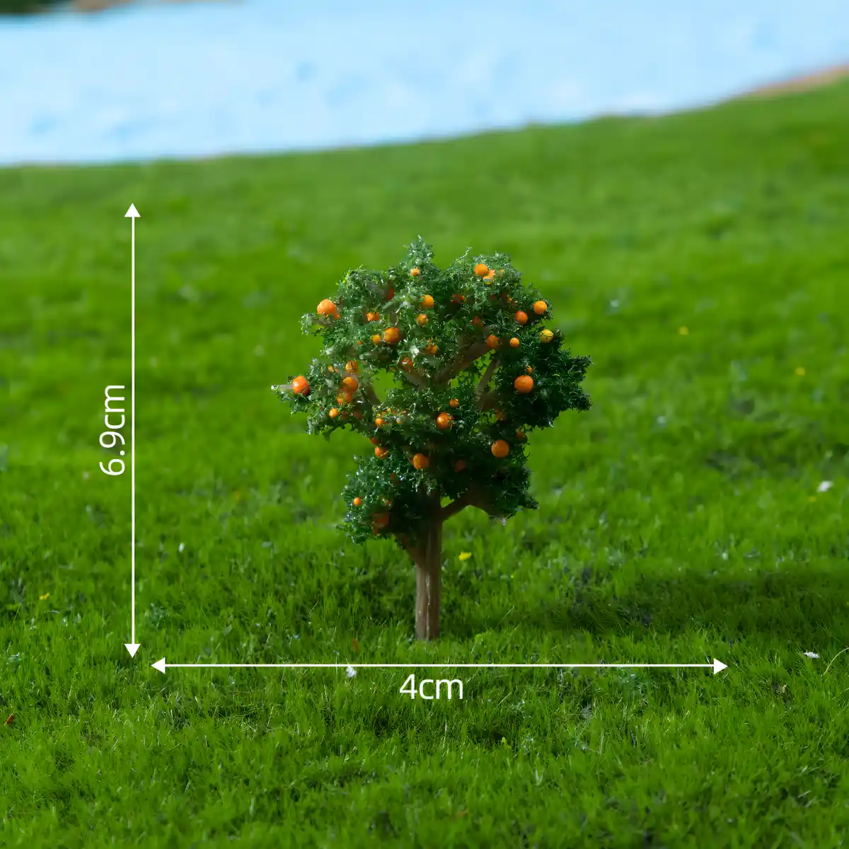 Realistic miniature orange tree with tiny fruit for dollhouse garden trees and DIY dioramas.