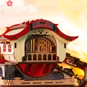 Top view of Japanese sushi boat model kit showing red-tiled roof and mechanical gear housing.
