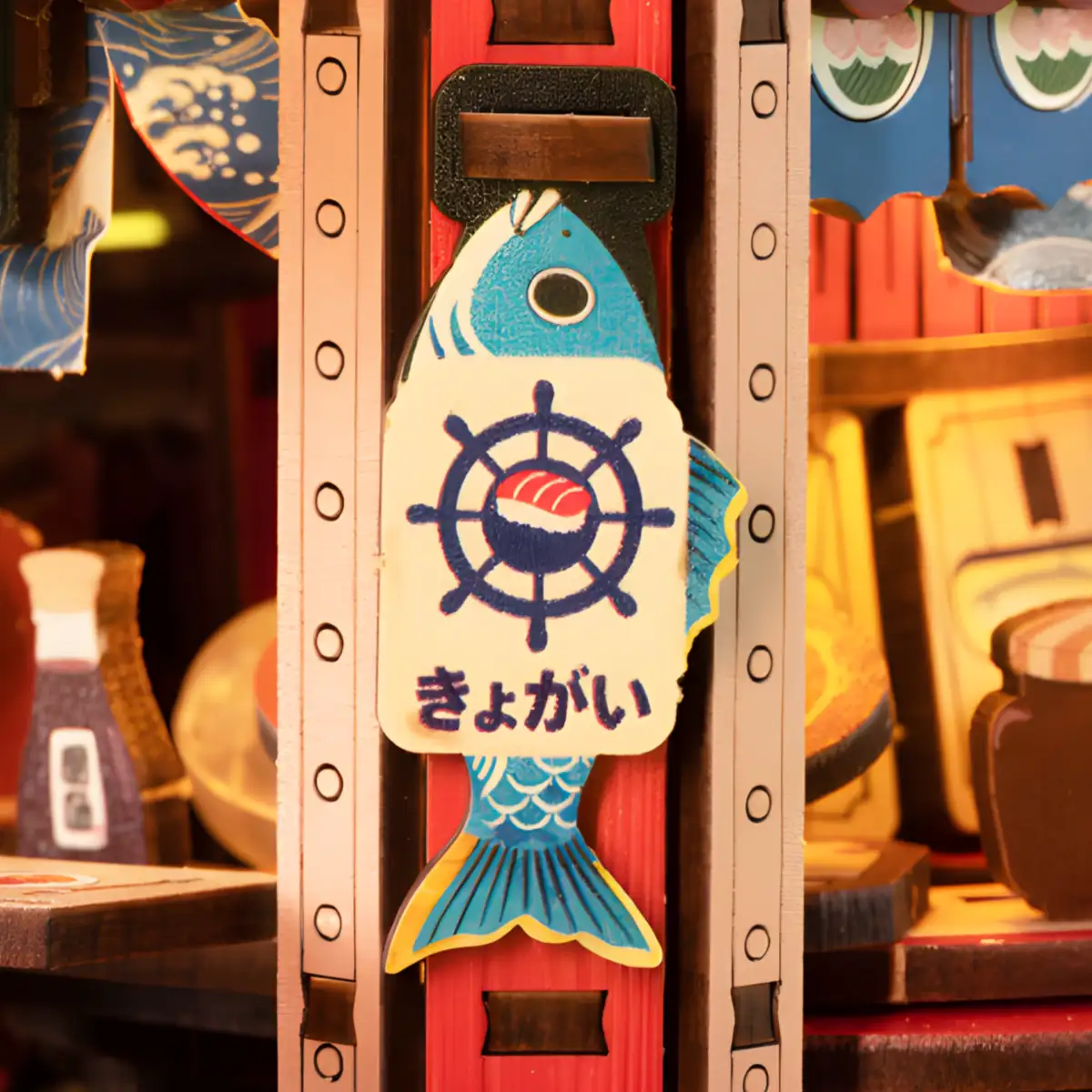 Fish-shaped Japanese sushi boat model kit sign with nautical wheel and Edo style wooden miniature kit details.