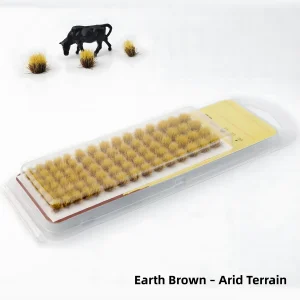 Earth brown static grass tufts for arid terrain miniatures and desert diorama scenery.