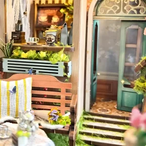 Close-up of teal door and mossy steps in the Sylvia Garden miniature garden kit.