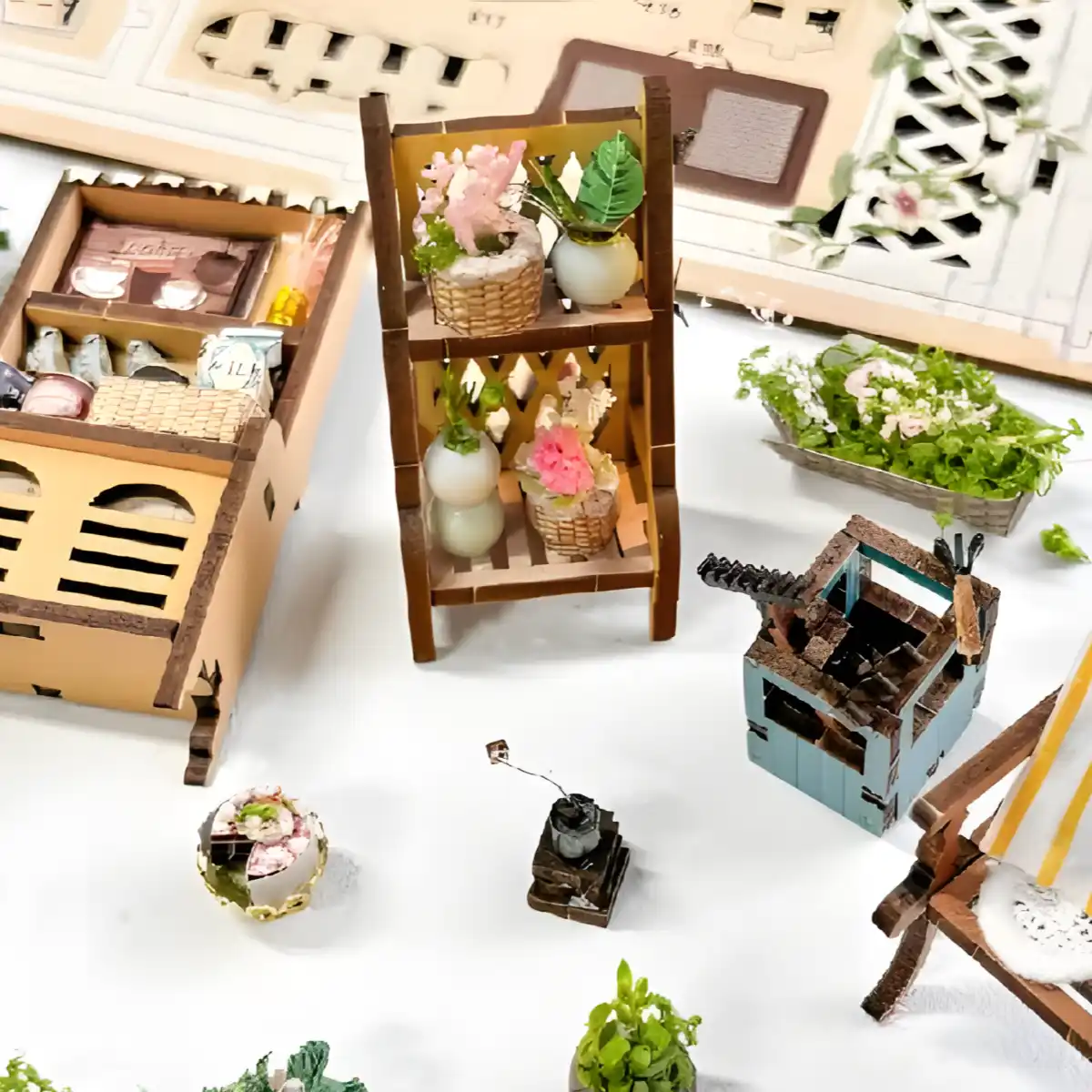 Miniature furniture and plant components for the Sylvia Garden DIY Book Nook Kit.