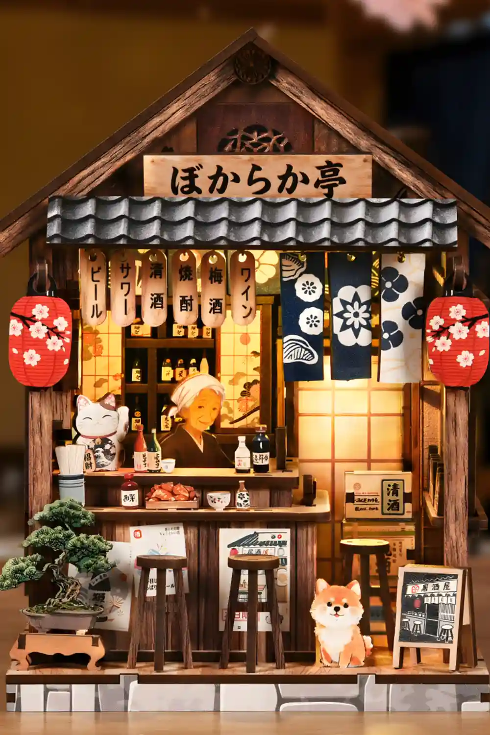 Detailed miniature Japanese Izakaya Book Nook with elderly woman shiba inu and lanterns