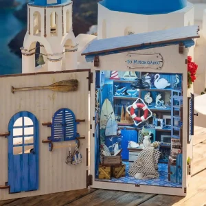 Opened Greek island miniature house showcasing a detailed beach themed book nook interior store.