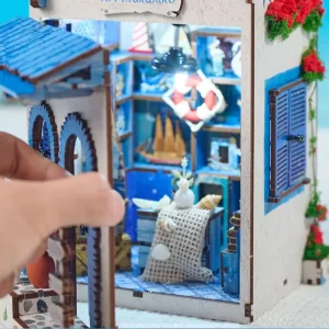 Fully opened immersive DIY book nook model displaying both facade and inner ocean shop.