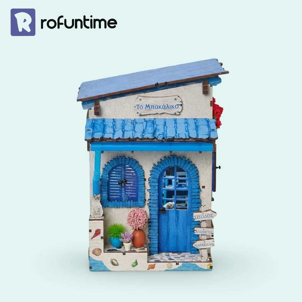 Front view of Beach Corner Book Nook, Mediterranean book nook with blue door and cat.