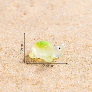Tiny green turtle piece from coastal DIY scene kit with scale lines