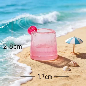 Pink shot glass drink miniature beach accessories component with dimensional scale lines.