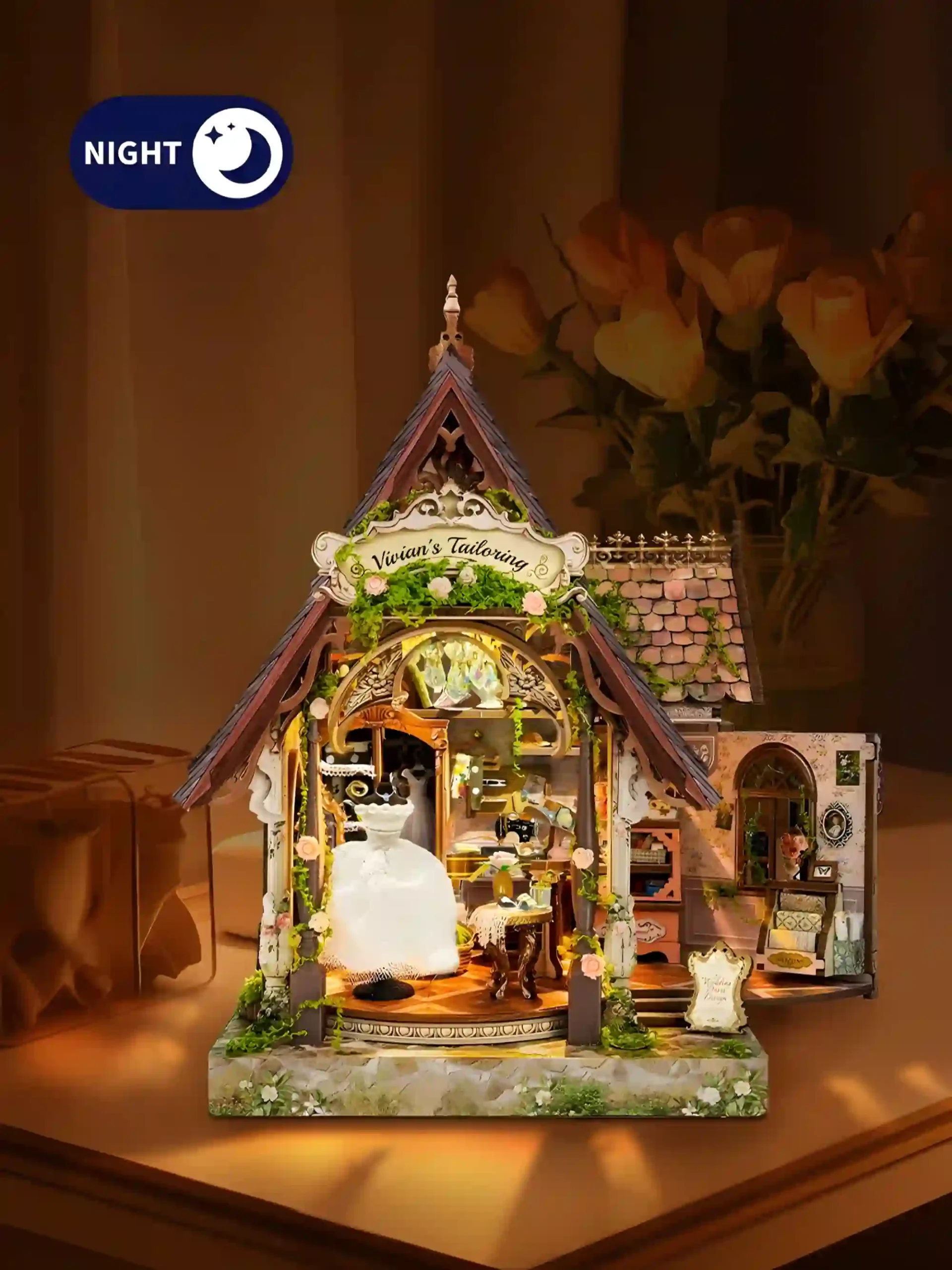 LED lighted book nook kit illuminating a vintage dressmaker tailor shop miniature scene