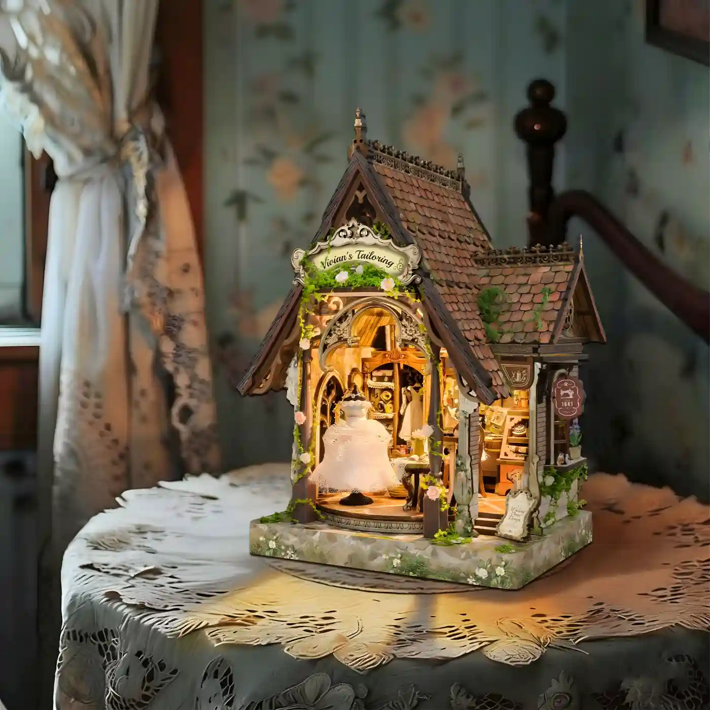 Romantic book nook kit bookshelf insert decor resting on an elegant lace tablecloth