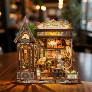 Floral Mark Café Book Nook kit showcasing a vintage coffee shop miniature scene
