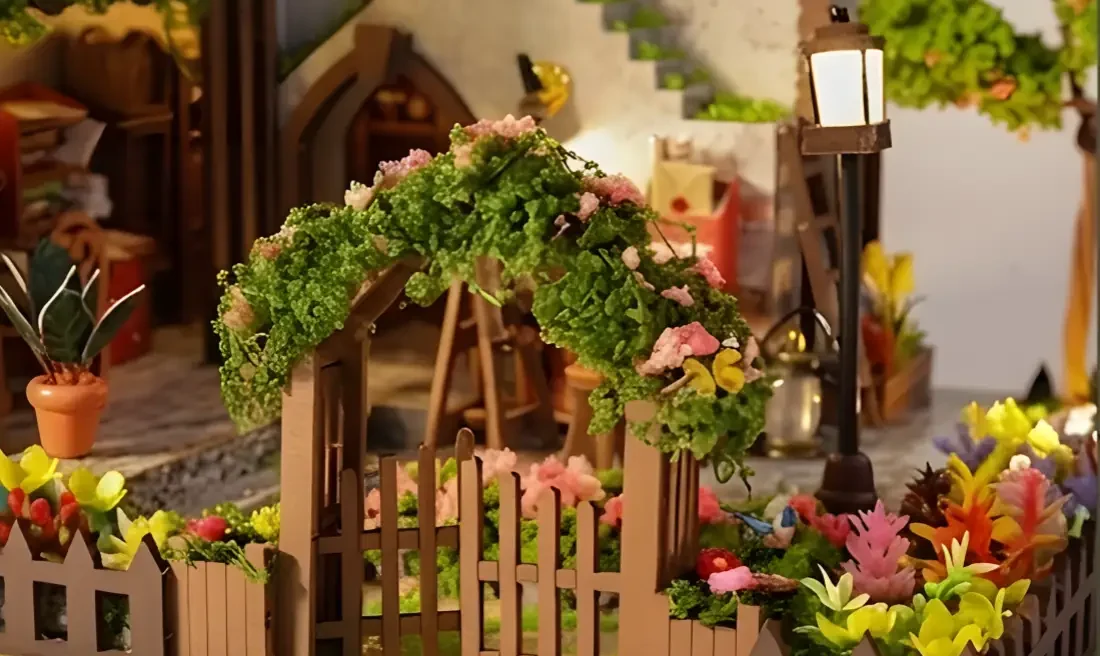 Garden Dollhouse entrance showing a beautiful flower cottage miniature gate with street lamp