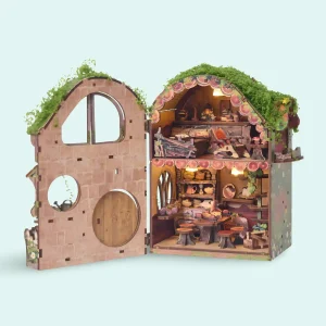 Forest book nook kit completely opened showing two floors of intricate cottagecore interiors