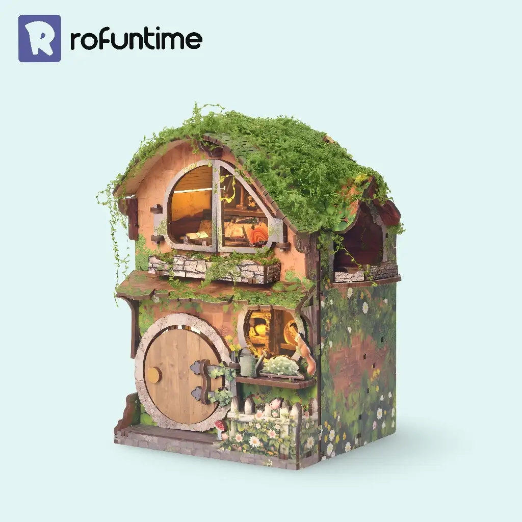 Green Vine Cottage Book Nook Hobbit style miniature house with moss roof on light background