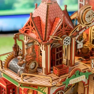 Architectural wooden model showing delicate rooftop carvings and vintage post office counter details.