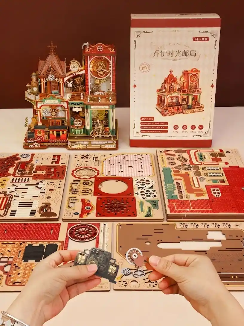 DIY mechanical model kit with unbuilt wooden building kit sheets and product packaging box.