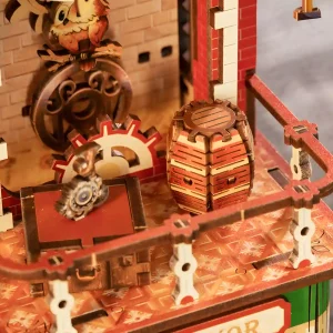 Moving gear wooden puzzle detailing a miniature wooden barrel and mechanical clock tower balcony.
