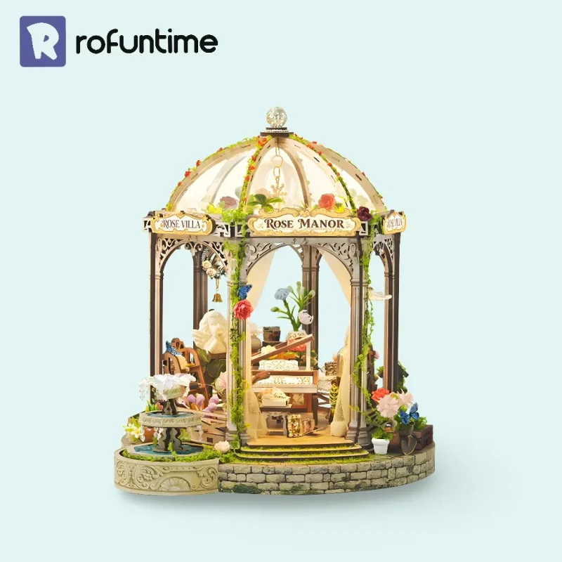 Rose Manor Miniature House under dome with piano garden scenery.