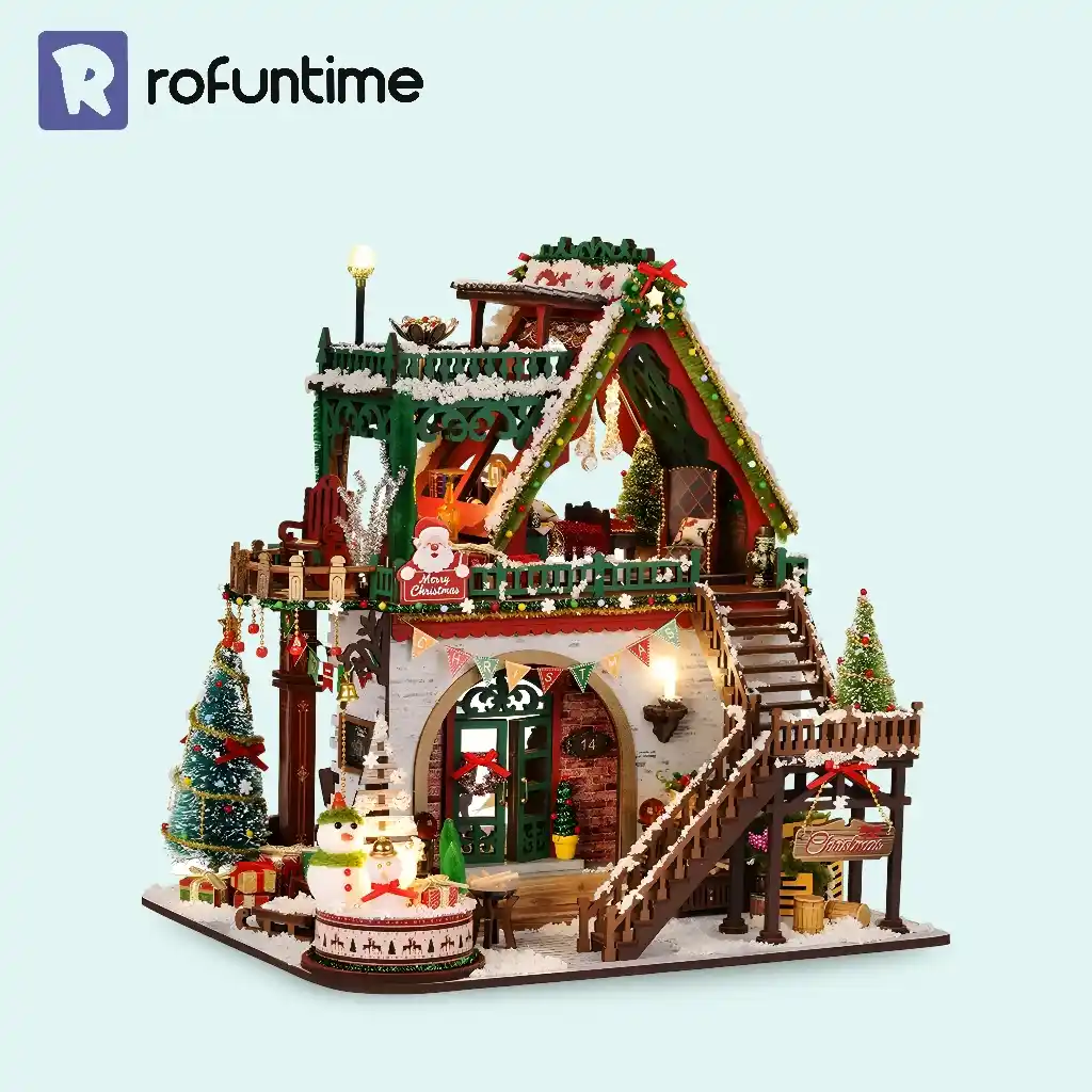 Snowy Christmas Lodge miniature house with LED lights, snow accents, and festive Christmas village display.