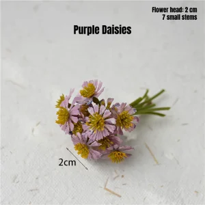 Purple miniature flowers with yellow centers for miniature garden decor and scene display