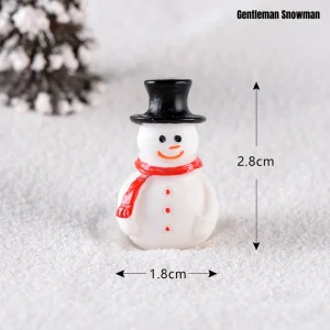 Gentleman miniature snowman with black top hat and red scarf for festive holiday scenes