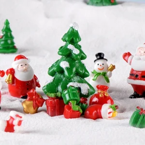 Complete miniature Christmas village scene with Santa Claus figurines trees and miniature gifts