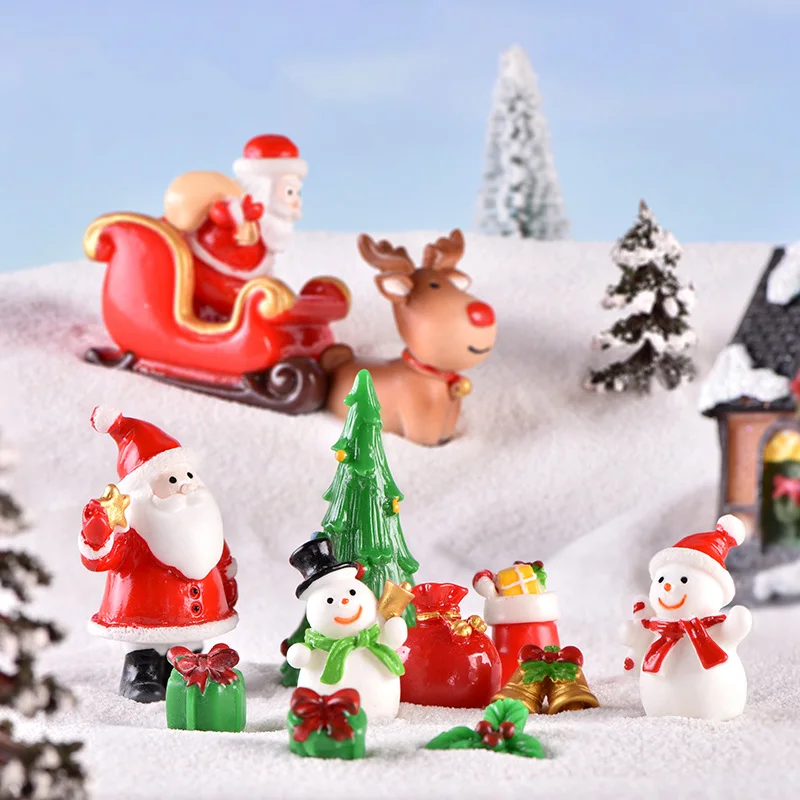 Cozy Christmas miniature accessories collection with Santa Claus figurines snowmen and reindeer sleigh