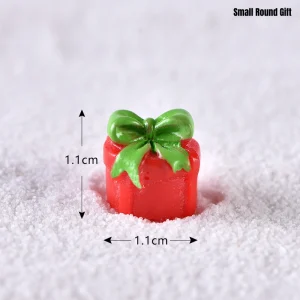 Small round red miniature gift box with green bow for miniature gifts collection