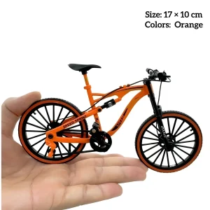 Hand holding orange miniature mountain bike model for bookshelf décor and dollhouse bicycle setups