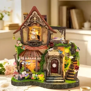Illuminated Dreamy Cottage Book Nook displayed as cozy shelf decor on a table.