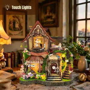 Dreamy Cottage Book Nook showing touch-activated LED lights in warm miniature room scene.