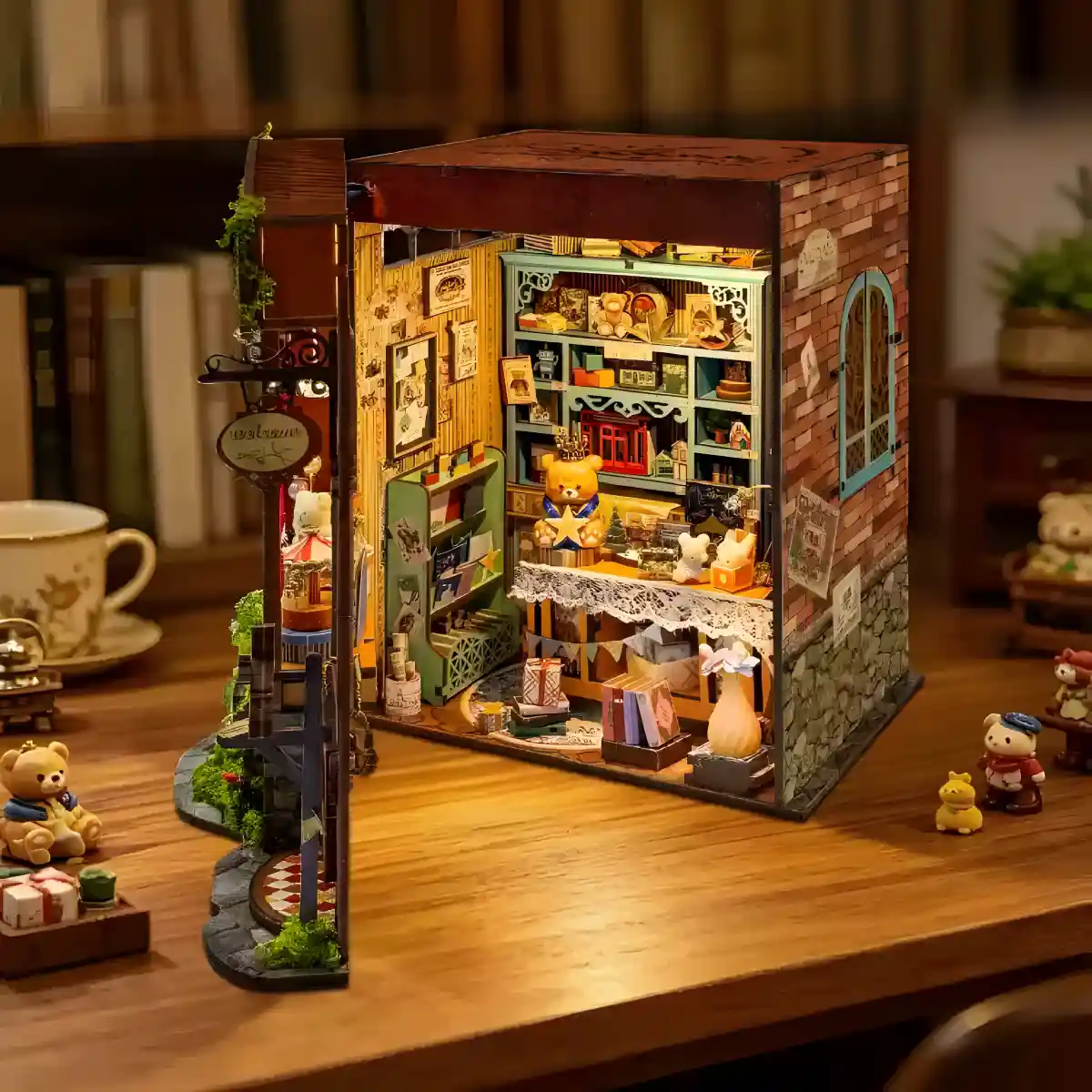Dreamy Fairy Tale House Book Nook opened on wooden table surrounded by miniature figures