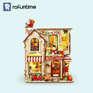 Enchanted Christmas Cottage Miniature House front view with Santa, snowman, and warm LED lights