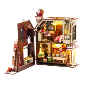 Unfolded Enchanted Christmas Cottage Miniature House showing interior rooms, Christmas tree, and candy shop