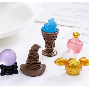 miniature magic props golden snitch sorting hat crystal ball goblet and love potion on desk