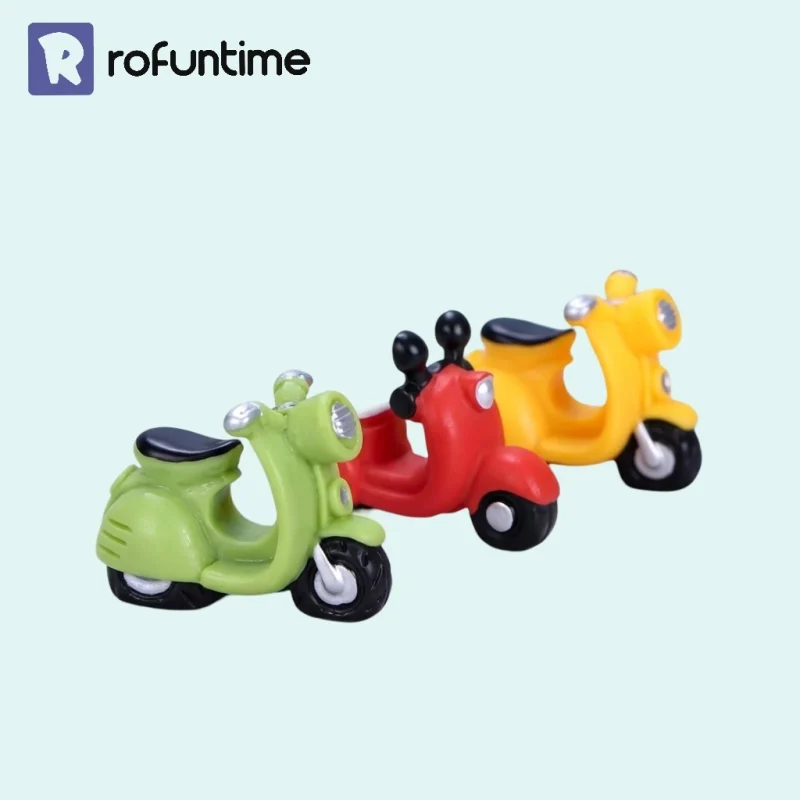 Green, red, and yellow resin miniature motorcycle models for DIY book nook accessories
