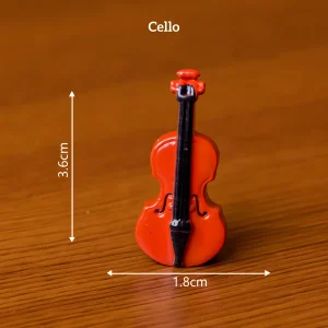 Red cello miniature musical instruments for DIY book nook accessories and artistic scene setups.